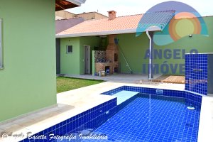 Casa lado praia com piscina á venda no bairro Jardim Beira Mar